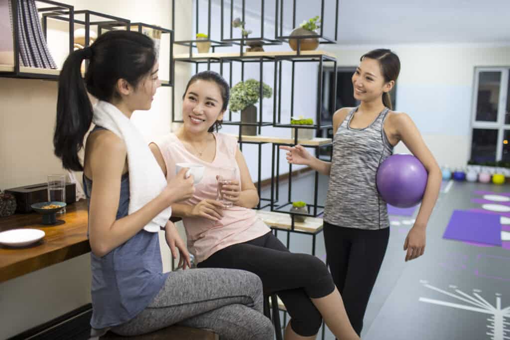 Best female friends resting at gym